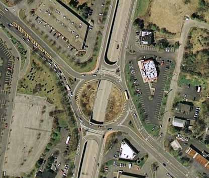 The photo provides an aerial view of a single roundabout or raindrop interchange at Thomas Circle in Washington, DC.