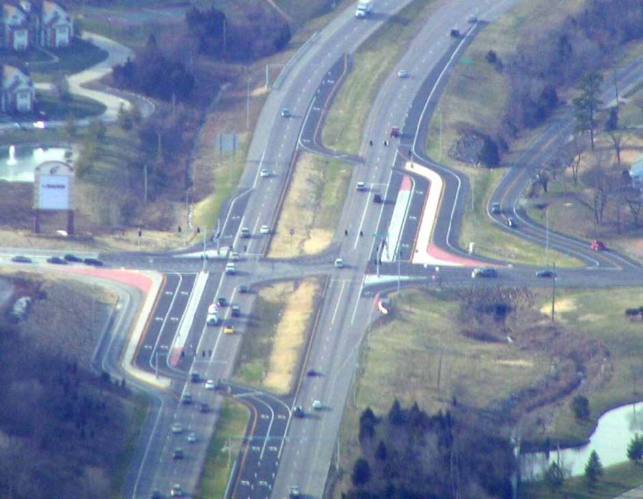 The photo shows a displaced left-turn (DLT) intersection at U.S. Route 30 and Summit Drive in Fenton, MO.