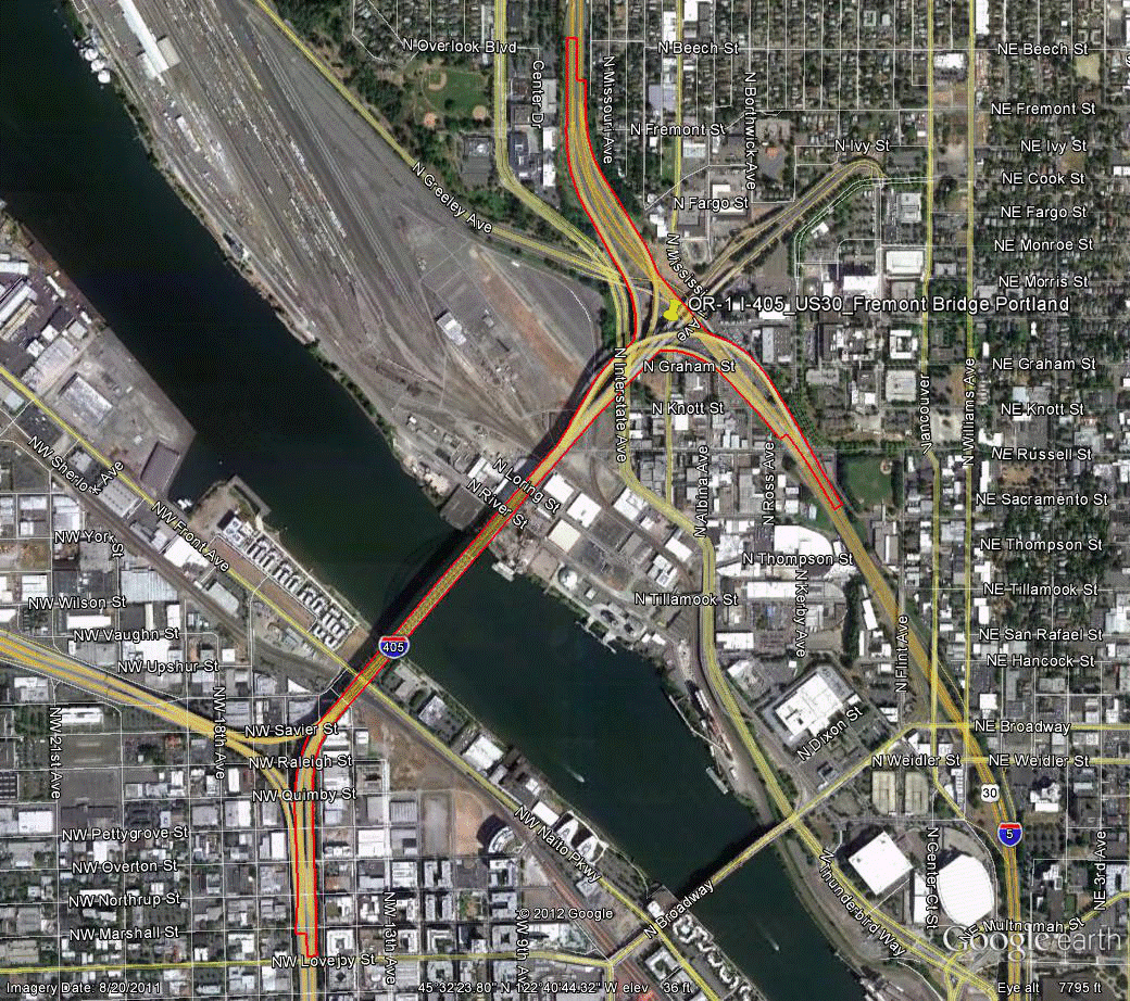 Figure 100. Photo. Aerial view of site OR-1. This figure shows an aerial photo of the interchange of I-5 with I-405/US-30/Fremont Bridge in Portland, OR. The study limits along each route were drawn on the aerial photograph.