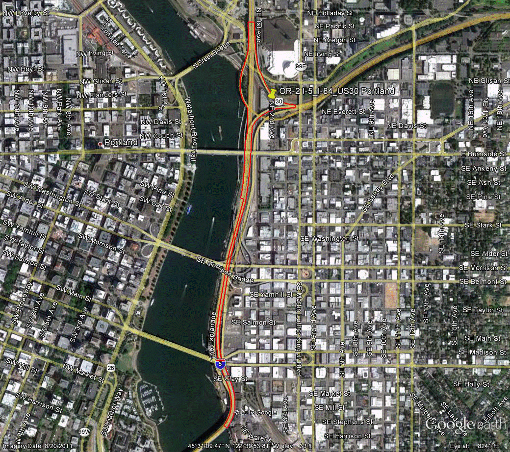 Figure 101. Photo. Aerial view of site OR-2. This figure shows an aerial photo of the interchange of I-5 and US-30 with I-84/US-30 in Portland, OR. The study limits along each route were drawn on the aerial photograph.