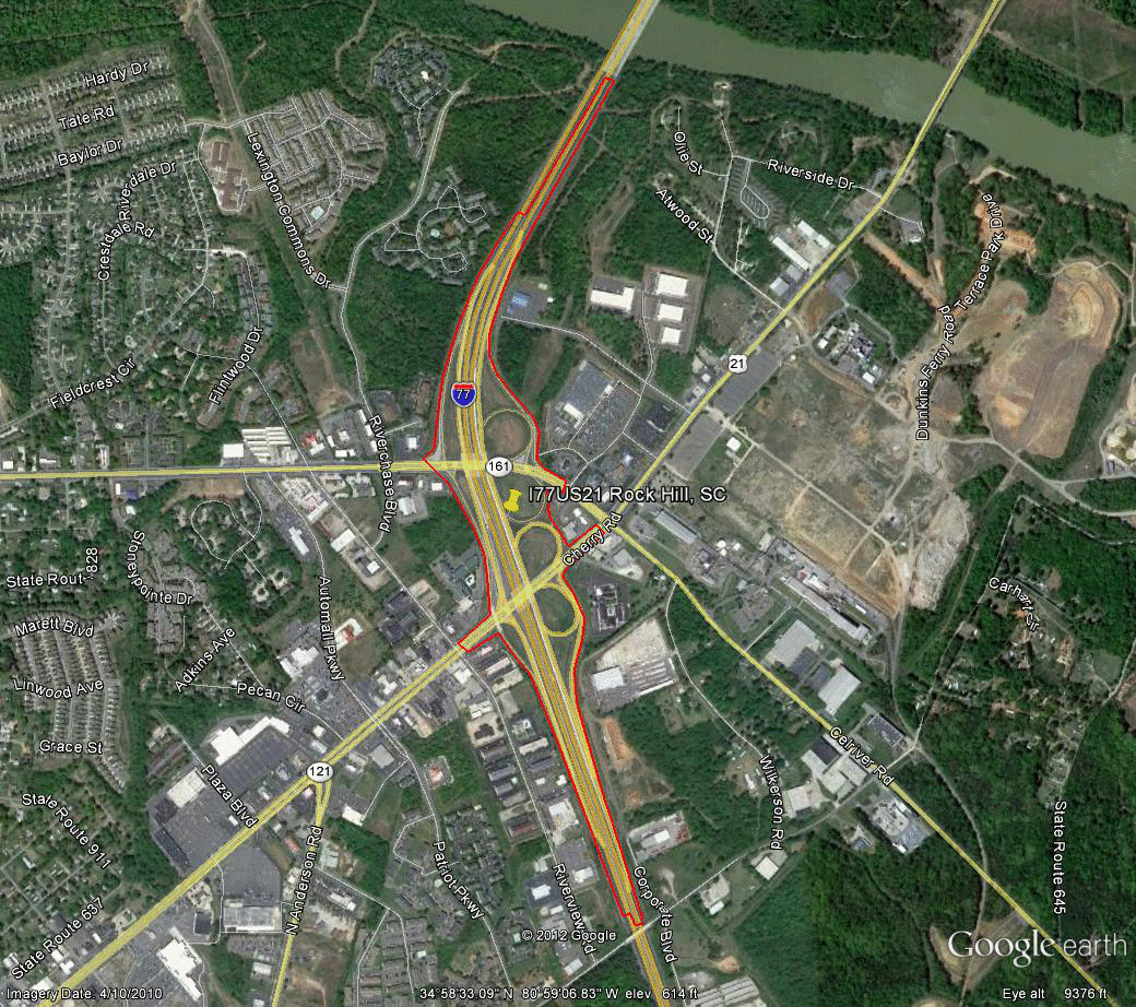Figure 104. Photo. Aerial view of site SC-3. This figure shows an aerial photo of the interchange of I-77 with US-21 in Rock Hill, SC. The study limits along each route were drawn on the aerial photograph.