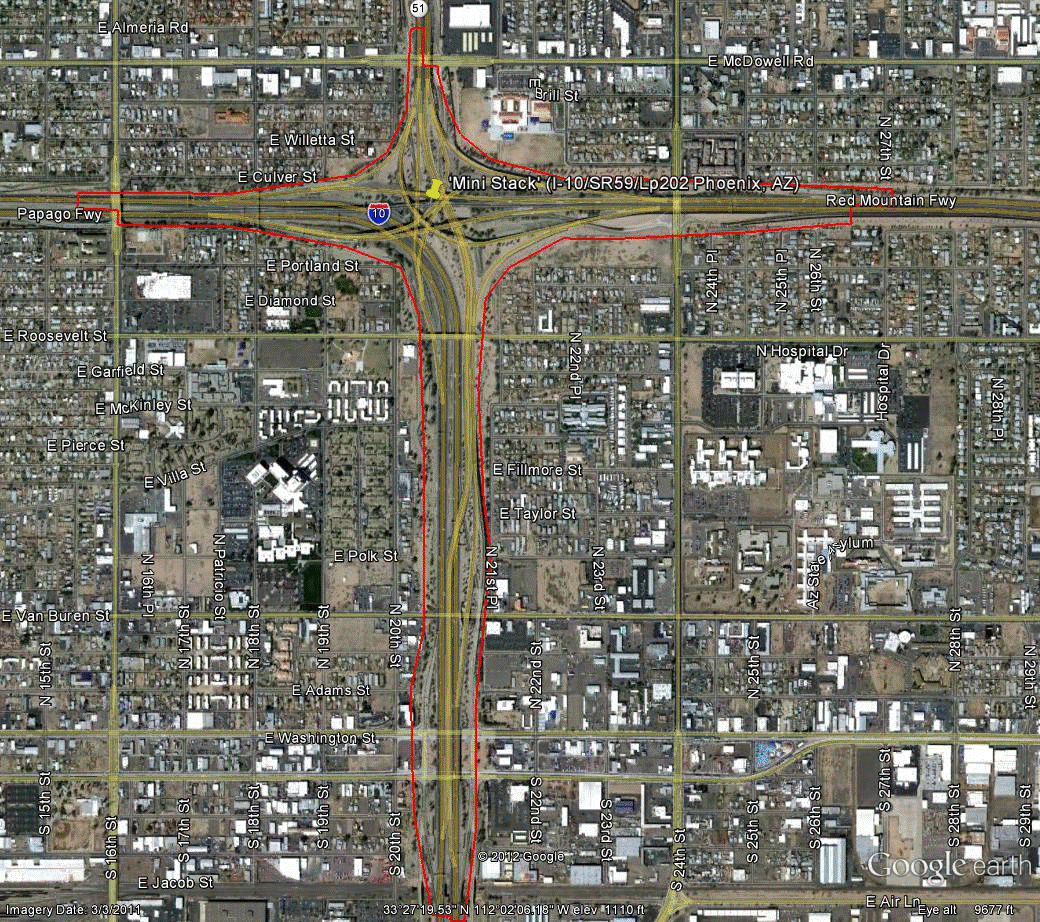 Figure 81. Photo. Aerial view of site AZ-2. This figure shows an aerial photo of the interchange of I-10 with SR 51 and LP 202 in Phoenix, AZ. The study limits along each route were drawn on the aerial photograph.