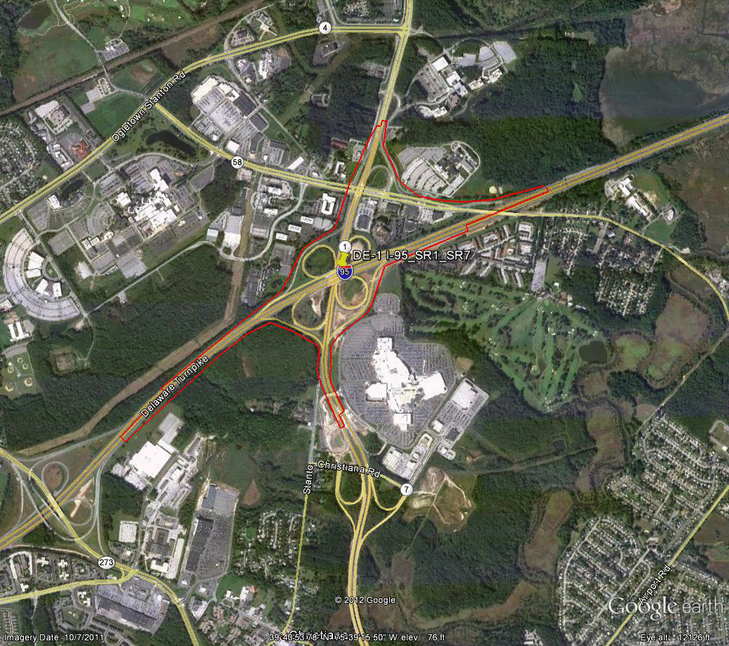 Figure 83. Photo. Aerial view of site DE-1. This figure shows an aerial photo of the interchange of I-95 with SR 1/SR 7 and Churchmans Road in Wilmington, DE. The study limits along each route were drawn on the aerial photograph.