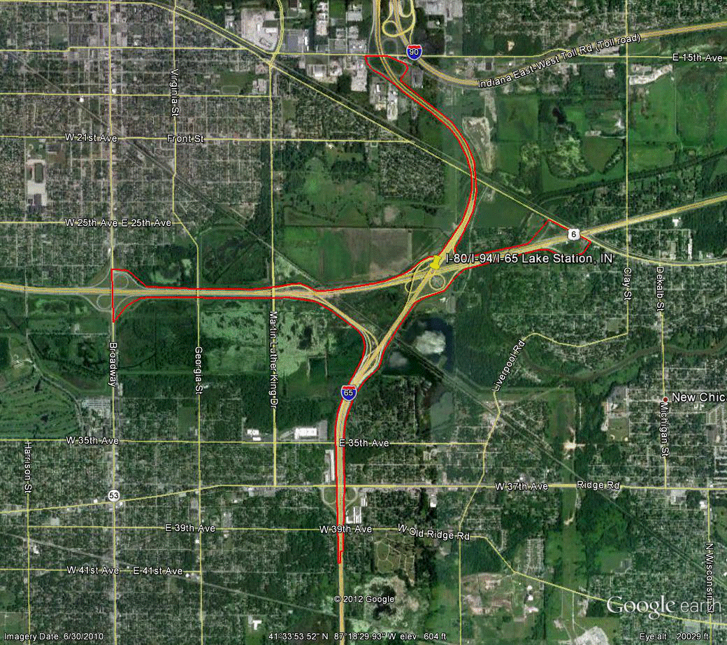 Figure 89. Photo. Aerial view of site IN-1. This figure shows an aerial photo of the interchange of I-80/I-94/US-6 with I-65 in Gary, IN. The study limits along each route were drawn on the aerial photograph.