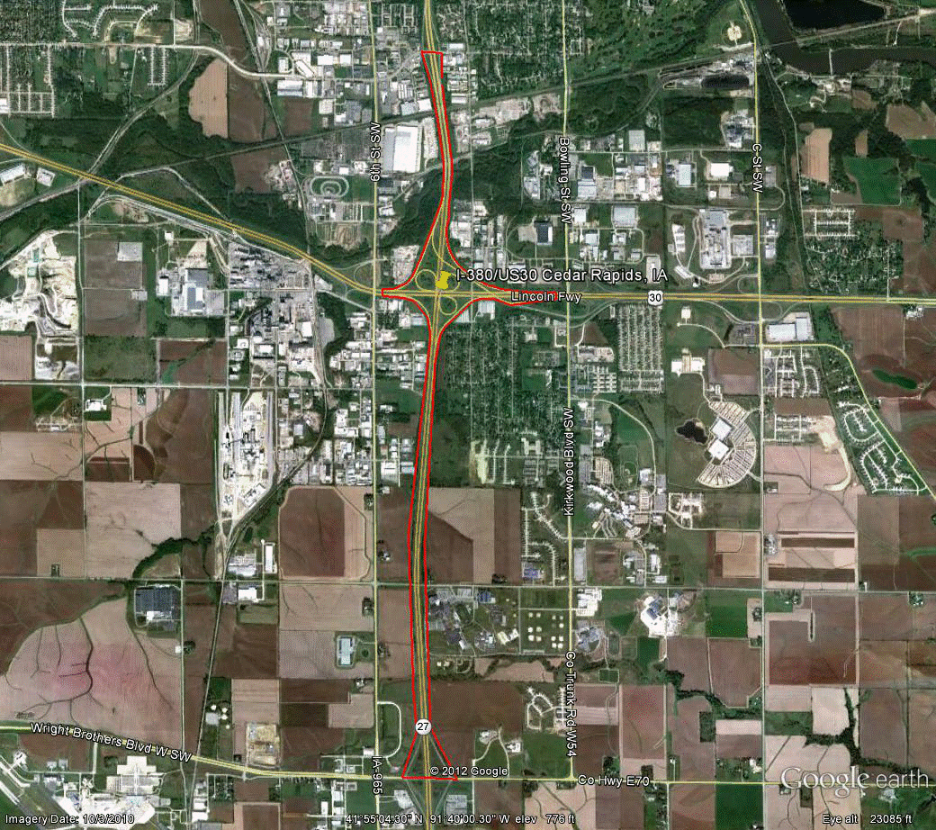 Figure 92. Photo. Aerial view of site IA-2. This figure shows an aerial photo of the interchange of I-380/SR and 27/US-218 with US-30/US-151/US-28 in Cedar Rapids, IA. The study limits along each route were drawn on the aerial photograph.