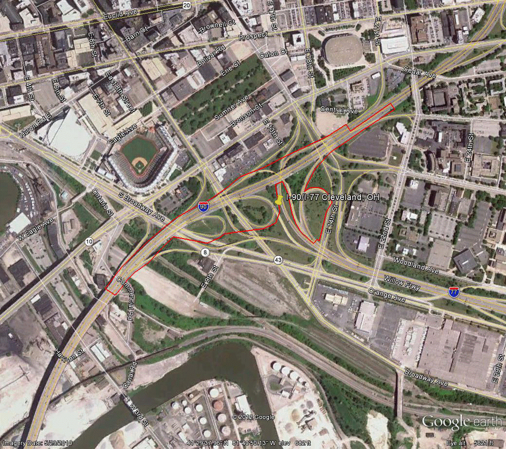 Figure 97. Photo. Aerial view of site OH-1. This figure shows an aerial photo of the interchange of I-90 with I-77 in Cleveland, OH. The study limits along each route were drawn on the aerial photograph.