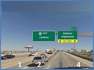 This photo shows an example test slide from topic 5. There is a four-lane single direction highway with lanes labeled 1 through 4 from left to right, with number 3 highlighted in blue. There are two signs that span the four lanes. The sign on the left spans lanes 1 and 2 and is labeled  60 East Lantana.  The sign on the right spans lanes 2 and 3 and is labeled  Madison Englewood.  Below that label, the sign is yellow and is labeled  Exit Only  with two arrows pointing down, one over lane 3 and one over lane 4. There is an extension off the top right of the sign labeled  Exit 45. 