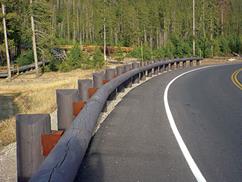 Figure 24. Photo. Barrier type 1—aesthetic timber barrier/wood guardrail.(17)