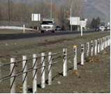 Figure 32. Photo. Barrier type 7—high-tension cable guardrail system.(15)