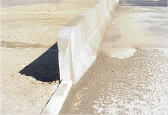 Figure 34. Photo. Second image of barrier type 8—Jersey barrier.(20)