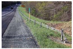Figure 35. Photo. Barrier type 9—low-tension cable guardrail.(21)