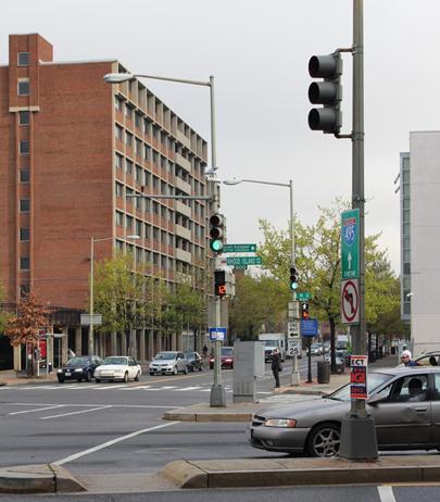 Illustration of what a pedestrian might see as he or she attempts to cross from the north side of Rhode Island Avenue Northwest to the south side of the street along 7th Street Northwest. The photo is taken from the perspective of the pedestrian.