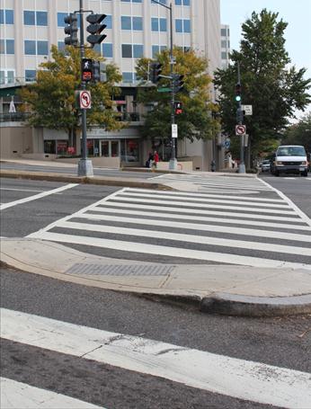 Illustration of what a pedestrian might see as he or she attempts to cross from the west side of Connecticut Avenue Northwest to the east side of the street along Florida Avenue Northwest. The photograph is taken from the pedestrian perspective.