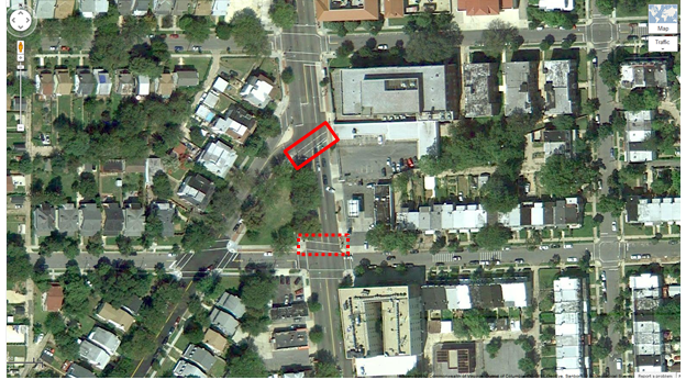 Aerial view of Location 11. The solid red rectangle highlights the intersection of Georgia Avenue Northwest and Arkansas Avenue Northwest. The dotted red rectangle highlights the intersection of Georgia Avenue and Farragut Street in Washington, DC. The District of Columbia Department of Transportation camera was positioned facing south and captured pedestrians crossing east/west on Georgia Avenue Northwest between Arkansas Avenue Northwest and Farragut Street Northwest. The aerial view presents a mix of urban residential and commercial property. A small park area is located between the two marked crosswalks.