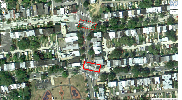 Aerial view of Location 12. The solid red rectangle highlights the intersection of Georgia Avenue Northwest and Irving Street Northwest. The dotted red rectangle highlights the intersection of Georgia Avenue and Kenyon Street in Washington, DC. The District of Columbia Department of Transportation camera was positioned facing north and captured pedestrians crossing east/west on Georgia Avenue Northwest between Irving Avenue Northwest and Kenyon Street Northwest. The aerial view presents a mix of urban residential and commercial property.