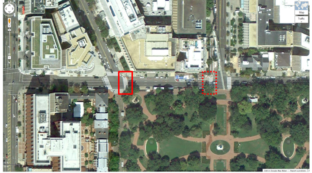 Photo. Aerial view of Location 13. The solid red rectangle highlights the intersection of H Street Northwest and Connecticut Avenue Northwest. The dotted red rectangle highlights the intersection of H Street and 16th Street in Washington, DC. The District of Columbia Department of Transportation camera was positioned facing east and captured pedestrians crossing north/south on H Street Northwest between Connecticut Avenue Northwest and 16th Street Northwest. The aerial view presents mostly commercial property. Lafayette Square Park can be seen in the southern portion of the photograph. 