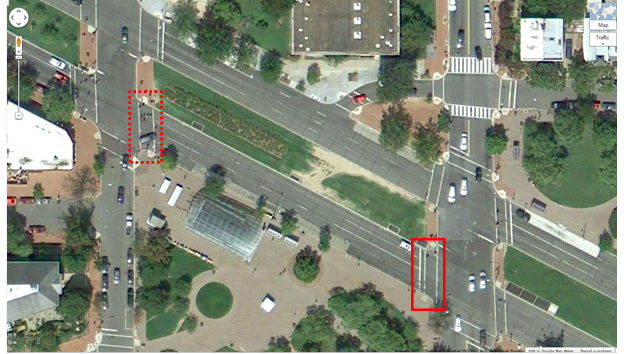 Aerial view of Location 15. The solid red rectangle highlights the intersection of Pennsylvania Avenue Southeast and 8th Street Southeast. The dotted red rectangle highlights the intersection of Pennsylvania and 7th Street in Washington, DC. The District of Columbia Department of Transportation camera was positioned facing west and captured pedestrians crossing north/south on Pennsylvania Avenue Southeast between 8th Street Southeast and 7th Street Southeast. A Metro station comprises the majority of the southern portion of the image. A grassy median with a worn grass path that divides bi-directional traffic can be seen. 