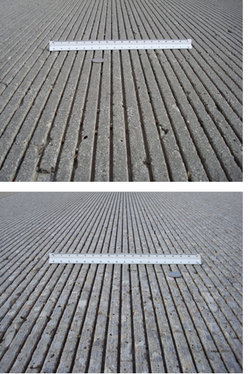 The top photo was taken looking down the length of a concrete  road with longitudinal grooves. A coin and scale are shown for reference. The  groove spacing is slightly smaller than the coin width. The bottom photo was  taken looking down the length of a concrete road with longitudinal grooves. A coin  and scale are shown for reference. The coin covers approximately one and a half  segments. Different colored aggregates are visible, but the surface appears  smooth.