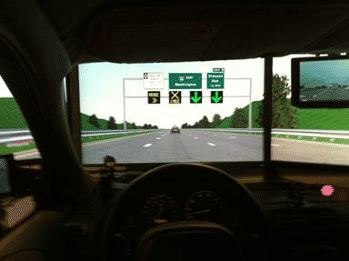 Figure 55. Photo. View of the three LCD monitors from slightly behind the driver's eye point.