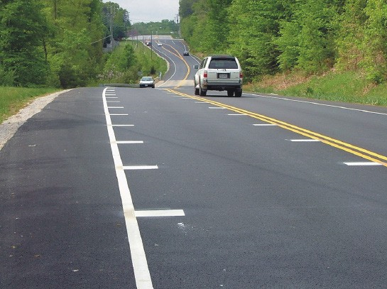 Figure 150. Photo. Optical speed bars. This figure shows an example of optical speed bars (OSB). OSBs are transverse markings with progressively reduced spacing installed on the roadway within a lane in a pattern to give drivers the impression that their speed is increasing. OSBs can be used on the whole roadway (transverse) or just on the edges (peripheral). 