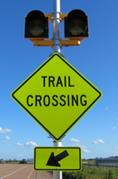Figure 23. Photo. C-A12, lap A study assembly. A Trail Crossing sign assembly with a set of 12-inch circular beacons above the W11-15a sign and the W16-7P arrow plaque. Figure 23. Photo. C-A12, lap A study assembly. A Trail Crossing sign assembly with a set of 12-inch circular beacons above the W11-15a sign and the W16-7P arrow plaque.