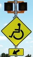 Figure 24. Photo. C-A12, lap B study assembly. A Handicapped sign assembly with a set of 12-inch circular beacons above the W11-9 sign and the W16-7P arrow plaque.