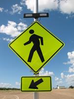 Figure 31. Photo. R-A, lap A study assembly. A Pedestrian Crossing sign assembly with a set of rectangular beacons above the W11-2 sign and the W16-7P arrow plaque. Figure 31. Photo. R-A, lap A study assembly. A Pedestrian Crossing sign assembly with a set of rectangular beacons above the W11-2 sign and the W16-7P arrow plaque.