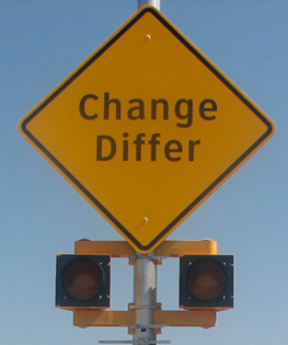 Figure 39. Photo. Discomfort glare assembly with circular beacons. A diamond-shaped warning sign with a set of 8-inch circular beacons below the sign. The sign reads “Change” on the first line and “Differ” on the second line. Figure 39. Photo. Discomfort glare assembly with circular beacons. A diamond-shaped warning sign with a set of 8-inch circular beacons below the sign. The sign reads “Change” on the first line and “Differ” on the second line.