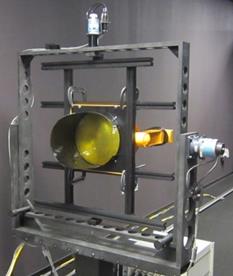 Figure 45. Photo. Mounted 12-inch circular beacon. A round beacon is shown mounted on equipment in a laborabory.