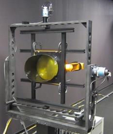Figure 45. Photo. Mounted 12-inch circular beacon. A round beacon is shown mounted on equipment in a laborabory. Figure 45. Photo. Mounted 12-inch circular beacon. A round beacon is shown mounted on equipment in a laborabory.