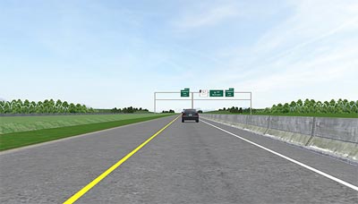 This figure shows a screen capture of a typical section of the simulated roadway. The back end of a gray sport-utility vehicle is shown in the distance in the middle of a single freeway lane. The lane has a yellow edge line on the left and a white edge line on the right. There is a concrete barrier a short distance to the right of the right edge line. To the left of the left edge line is a breakdown lane. To the left of the breakdown lane is a grassy median.