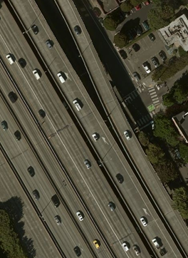 Satellite imagery of northbound Interstate 5 (I-5) (collector–distributor) C/D roadway north of I-90 with multiple successive lane-reduction arrows. This photo displays an effective use of lane narrowing arrows on an Interstate C/D roadway.
