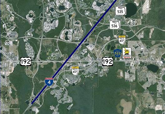 Photo. Area map of Orlando, FL, data collection segment. This photo represents a composite view of data collected by unmanned aerial vehicles from a particularly complex system design. For clarity, a blue graphic line was superimposed over the interstate pictured. I-4 and 7 roadways that interact with the interstate are identified.