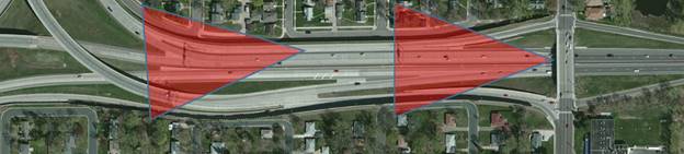 Photo. Camera locations at site 31-2 (Minnesota TH 62 approaching I-35W). This aerial photo shows driver behavior and destination selection, left and right, from a roadway approaching an interstate. The aerial image includes two red triangles, which highlight the areas of the roadway where the two cameras were installed and the area covered by those cameras. Two attributes are present: auxiliary lanes—attribute 4110; and guide signs for option lanes—attribute 5130.