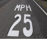 This is a photo of a speed limit pavement marking in the center of a travel lane that reads as follows: 'MPH 25.'