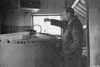 Figure 12. Testing of salt brine concentration with a hydrometer.