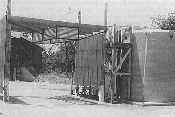 Figure 14. Overhead spraybar for prewetting chemical load in truck.