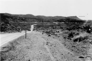 Figure 9. Typical Roadway with Roadside Hazard Rating Equal to 2. This picture shows a two-lane road with a clear zone between 6 and 7.5 m (20 and 25 feet) from pavement edgeline, which is recoverable. 