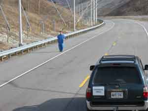 Photo. Object: pedestrian, blue denim clothing, left (BlueLF). Click here for more detail.