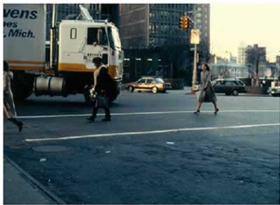 Figure 19 Turning vehicles like the moving truck pictured here that is steering toward pedestrians in the crosswalk, pose a particular threat to pedestrians at intersections