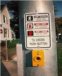 Figure 32. Illuminated pedestrian push buttons, such as the apparatus posted on the light pole by a crosswalk in this picture, were not found to alter pedestrian crossing behavior