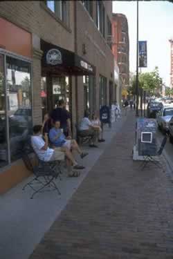 Figure 3. Pedestrian capacity of CBD sidewalks is reduced by light posts, mailboxes, parking meters, etc.