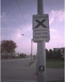 Figure 26. Crosswalk treatments such as lighted signs have been used in an attempt to affect pedestrian and/or motorist behaviors