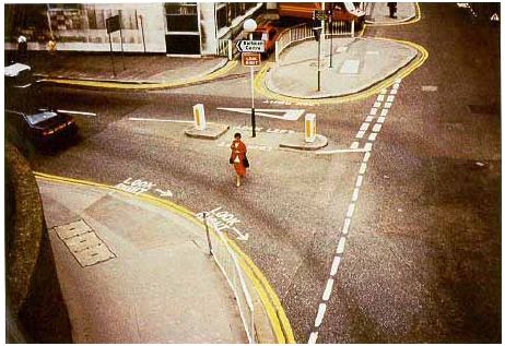 "Look Right" or "Look Left" is painted on the street next to the curb in the United Kingdom.