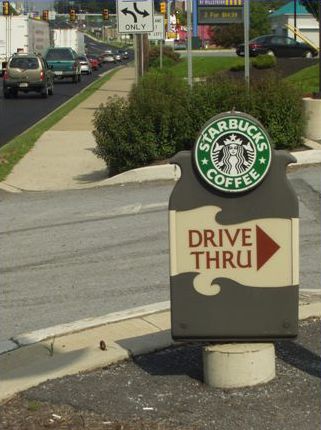 Photo of the entry drive of a drive-thru coffee restaurant.