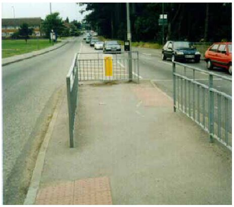 Staggered crosswalk with fencing.
