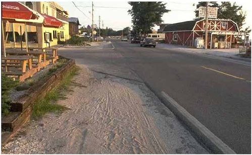 Roadways with paved shoulders should reduce on-road debris.