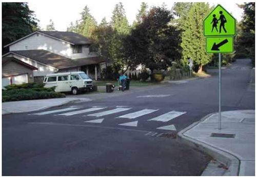 Speed humps can be combined with curb extensions and a winding street alignment.