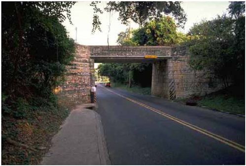 Example of a sidewalk ending at a bridge abutment with no warning or alternative path.