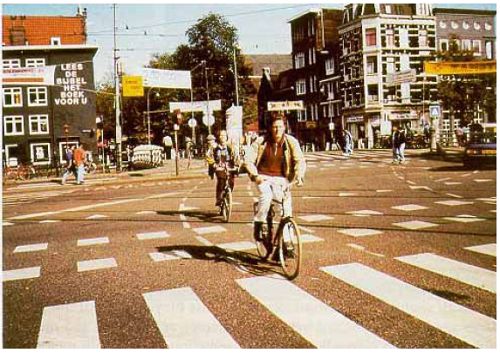 Bicycle lane markings carried through an intersection in The Netherlands.